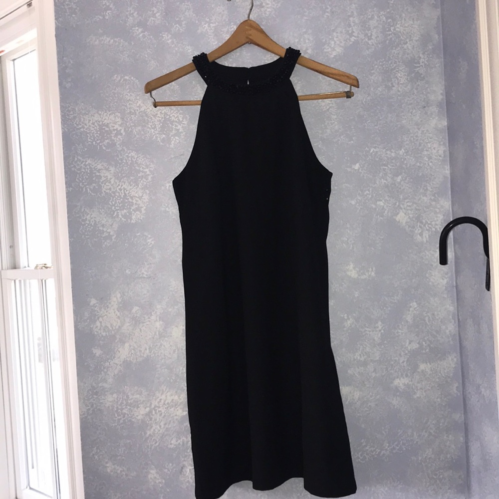 sleeveless black cocktail shift dress
